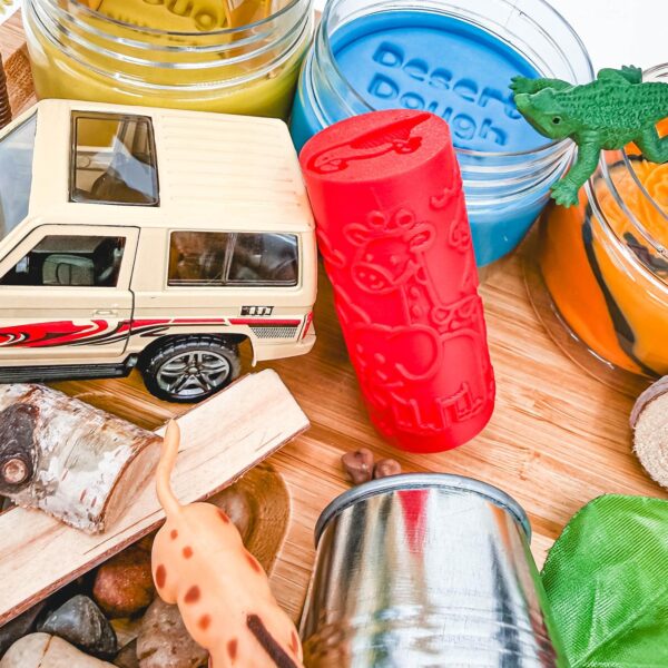 Close-up of the Animal Adventure Signature Playdough Kit with safari jeep, animal pattern roller, colorful Playdough jars, and sensory play accessories.