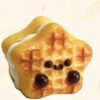 Cute, animated square toast with a glossy orange glaze, chocolate eyes, and a happy smile.