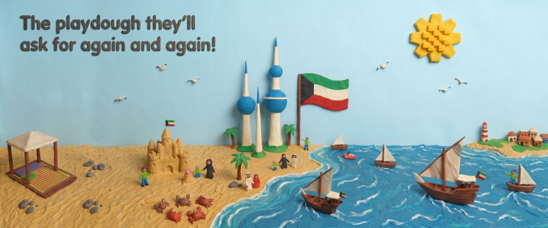 Clay playdough beach diorama with sand, palm trees, sandcastles, people, a Kuwait flag, boats on the sea, and the slogan 'The playdough they'll ask for again and again!'